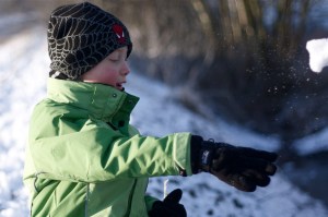 Throwing ice on frozen water